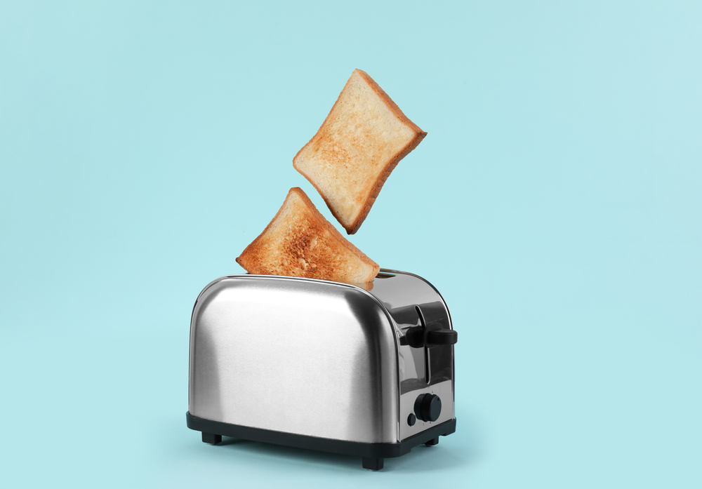 modern toaster popping up toast